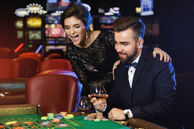 Live roulette table at idebet slot showing dealer, spinning wheel, and betting interface on mobile screen